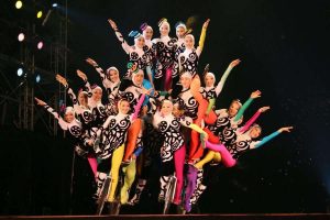 Live Chinese acrobatics show in Beijing, featuring skilled show demonstrating balancing, tumbling, and contortion acts